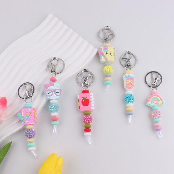 oly-bdd89c3e4523dfcd832230dbc11f35e1 Wholesale Silicone Book Keychain Ornament Party Gift Fashion Accessory