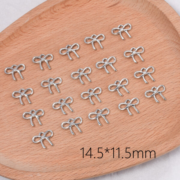 oly-bf27b19b50544b278fc2914ba5843ef2 Wholesale Trendy Small Bow Tie Pendant Zinc Alloy Fashion Accessory for DIY Jewelry Making Gift Resale