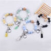 oly-c09ce8131c58cf40ea674793883f0926 Wholesale Light Yellow Silicone Korean Style Wrist Keychain with Tassel Fashion Accessory Gift Boutique Resale