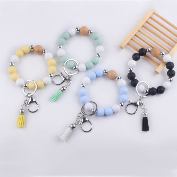 oly-c09ce8131c58cf40ea674793883f0926 Wholesale Light Yellow Silicone Korean Style Wrist Keychain with Tassel Fashion Accessory Gift Boutique Resale