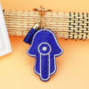 oly-c4ff95a6040086af4e83a9feadca3a9c Wholesale Trendy Hamsa Hand Rhinestone Keychain Light Blue Flannel with Tassel Boutique Resale Gift