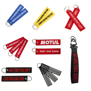 oly-c5aeb921a124b4c90b396c8663845f26 Wholesale Grass Green Flight Tag Keychain with Remove Before Pew Pew Text - Car Key Accessory Gift