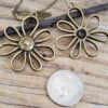 oly-c6a9cc468b5458ff8c503d1630b38cfa Wholesale Ancient Gold Alloy Flower Pendant Necklace for Women Gift Jewelry Accessory