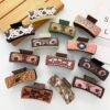 oly-c6eebc522d4558e68dba48987d903a0e Wholesale Leopard Print Acrylic Hair Claw Clip Stylish Fashion Accessory for Everyday Styling Boutique Resale