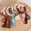 oly-c6f79a6725a0b694dfcf21c58ad76df3 Wholesale Silicone Keychain Retro Face Wooden Plaque Tassel Wristlet Party Gift for Junior
