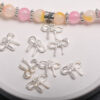 Wholesale Silver Alloy Light Luxury Bow Pendant DIY Jewelry Charm for Bracelet Phone Chain