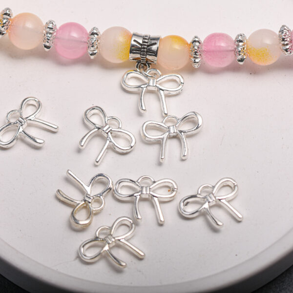 Wholesale Silver Alloy Light Luxury Bow Pendant DIY Jewelry Charm for Bracelet Phone Chain