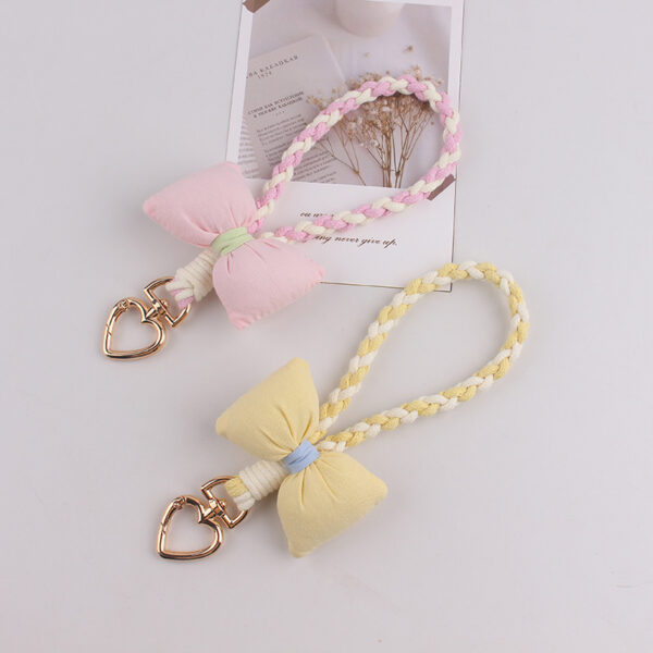 oly-cc664122b240a6b29fea3e91ca2be837 Wholesale Silicone Dopamine Bow Phone Strap Heart Keychain Fashion Accessory Yellow