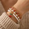 oly-ce8b83f210e6e06256a0b87c612b13c2 Wholesale Sweet Cherry Pearl Multi Layer Bracelet Set Alloy Electroplated Jewelry Gift for Women
