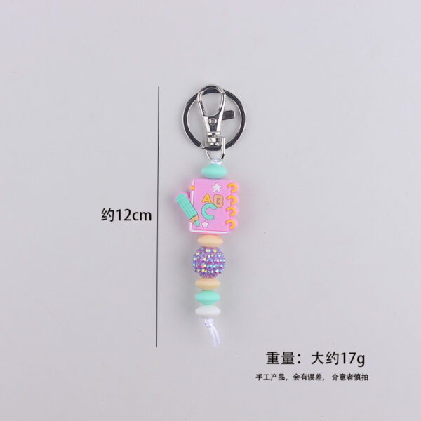 oly-cfb0b72c684c72f85cf4ccafcc439360 Wholesale Silicone Book Keychain Ornament Party Gift Fashion Accessory