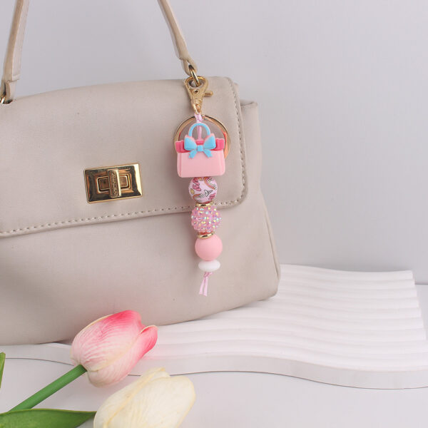 oly-d0475701b588f3ccf6a47b151b46f825 Wholesale Fashion Silicone Perfume Bottle Keychain Resale Gift Accessory