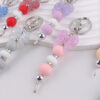oly-d24480a9476f2321b6d77377efa12544 Wholesale Silicone Bow Beaded Bag Charm Keychain Fashion Accessory Gift for Party