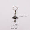 oly-d2c9cc15c44fecd9de7c51d433f7f320 Wholesale Silver Titanium Steel Flame Cross Keychain Trendy Car Key Accessory