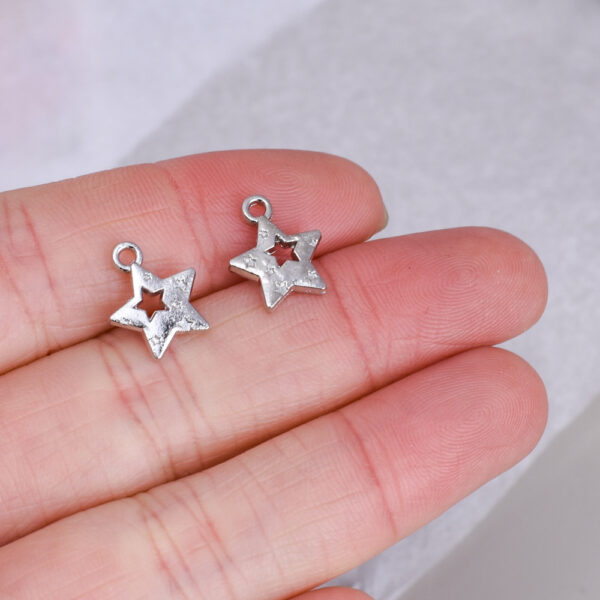 oly-d31e5c6bd120b2a0e6643c52a81c5c9d Wholesale Hollow Five Pointed Star White Tone Alloy Charm DIY Jewelry Bag Charm Fashion Accessory