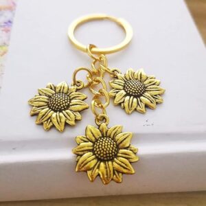 oly-d4b7f18143bb4d2288cf9ca5d587206f Wholesale Pastoral Style Sunflower Tassel Keychain, Alloy Keychain Pendant, Fashion Accessory for Gifts