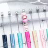 oly-d76d2f58c4035e46874965d02af43d52 Wholesale Plastic Beaded Pens with Embossed UV Design Multicolor Rotating for Office Gift Resale