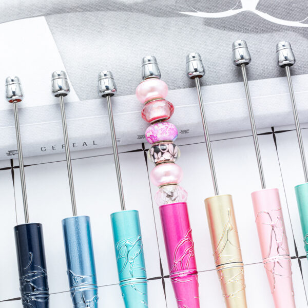 oly-d76d2f58c4035e46874965d02af43d52 Wholesale Plastic Beaded Pens with Embossed UV Design Multicolor Rotating for Office Gift Resale
