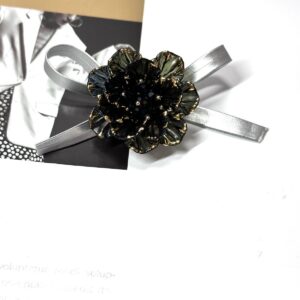 One black bead with gold edge