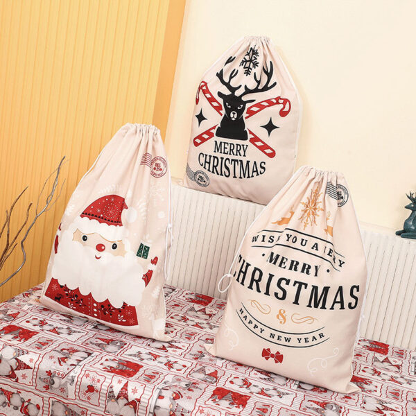 oly-dc0a7eba666696b2a43155ba6acb1787 Wholesale Christmas Santa Canvas Drawstring Gift Bag – Holiday Party Decorative Bag for Resale
