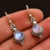 oly-ddb9e64fb30a256cbcce8328b24a0931 Wholesale Alloy Blue Topaz Drop Earrings Creative Rotating Geometric Trendy for Women