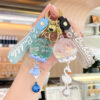 oly-de1c99b813194409a91b43575986562c Wholesale Oil filled Wind Chime Acrylic Keychain Bag Charm Gift for Boutique Resale