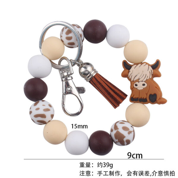 oly-e201683637364f6f5681f06285db8ef2 Wholesale Silicone Cartoon Cow Keychain with PU Leather Tassel Fashion Accessory Bag Charm for Gift Boutique Resale