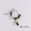 oly-e40e59187d68973826f7f5a12de05532 Wholesale Silicone Cross Print Bead Bracelet Keychain with PU Tassel Fashion Accessory for Resale