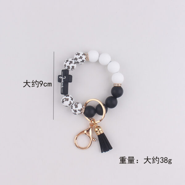 oly-e40e59187d68973826f7f5a12de05532 Wholesale Silicone Cross Print Bead Bracelet Keychain with PU Tassel Fashion Accessory for Resale
