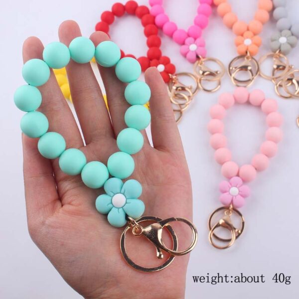 oly-e411589af158a1b65c4965b1f671c3b1 Wholesale Pink Silicone Cartoon Flower Beaded Wristband Keychain Boutique Jewelry Accessory
