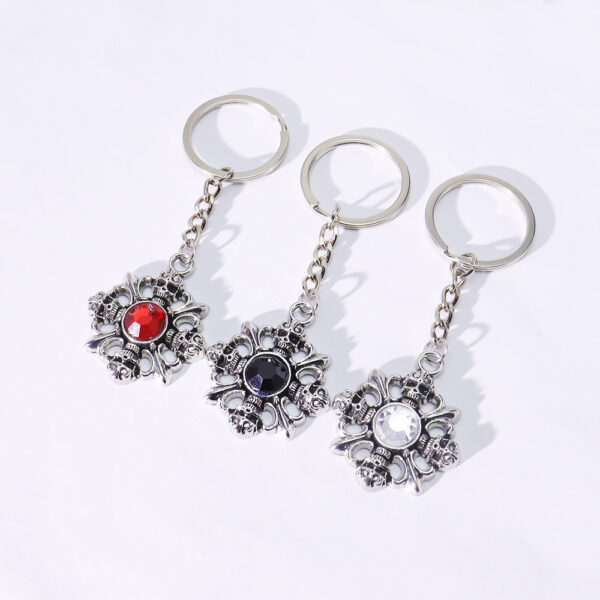 oly-e62bf4c06c986b382a182fa948978dd3 Wholesale Retro Red Gemstone Skull Alloy Keychain Pendant Boutique Resale Keychain Accessory