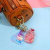 oly-e6dc5987d5ca9a3dcb4408337cef971a Wholesale Ice Cream Oil Red Glow Gas Tank Keychain Bag Charm Boutique Resale
