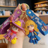 oly-e88fcb91571f0ef2c4bf1f60d2085629 Wholesale Cartoon Keychain Book Academy Doll Bag Charm Car Key Accessory Gift OLY Exclusive