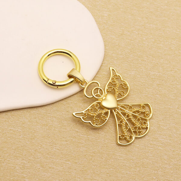 oly-ea92618d7dbfb1a8cb19e41faf042b55 Wholesale Retro Geometric Bohemian Keychain Pendant Zinc Alloy Trendy Gift