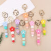 oly-ed2f070ab044cefa10d0c05f7e07baaa Wholesale Pink Silicone Bead Bracelet Cartoon Flower Keychain DIY Pendant Fashion Accessory Gift