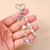 oly-f256b0cc27f85f01d1504055b4aa075f Wholesale Modern Minimalist Bow Bead Keychain, Zinc Alloy Star Heart Design, Casual Bag Charm Accessory