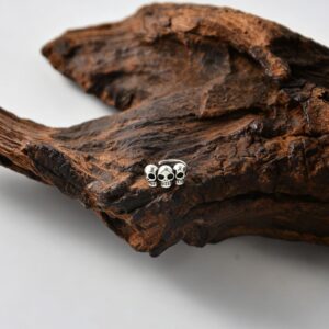 One three-skull ear clip - silver