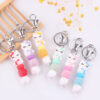 oly-f4db493b5ea1748be8b26804aafe923a Wholesale Silicone Cartoon Cat Bead Bracelet Keychain Trendy Bag Charm for Party Favors