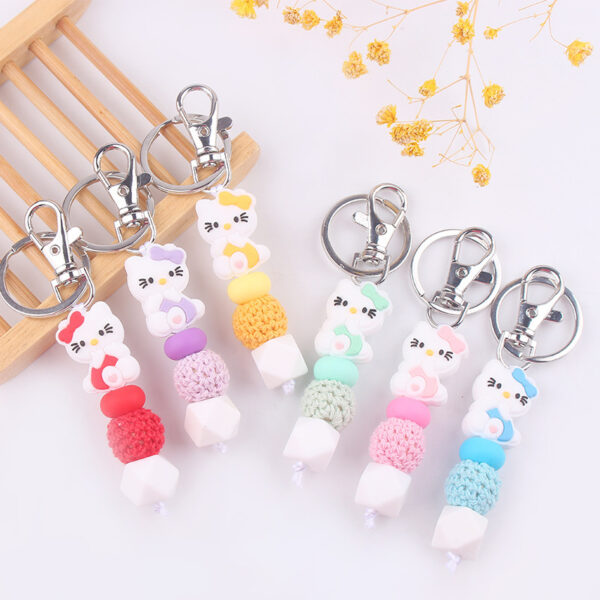 oly-f4db493b5ea1748be8b26804aafe923a Wholesale Silicone Cartoon Cat Bead Bracelet Keychain Trendy Bag Charm for Party Favors