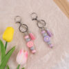 oly-f76046f6fd545d25ed6e538e2634919f Wholesale Silicone Keychain - Stylish Bag Charm with Tassel, Pink, Party Favor Gift