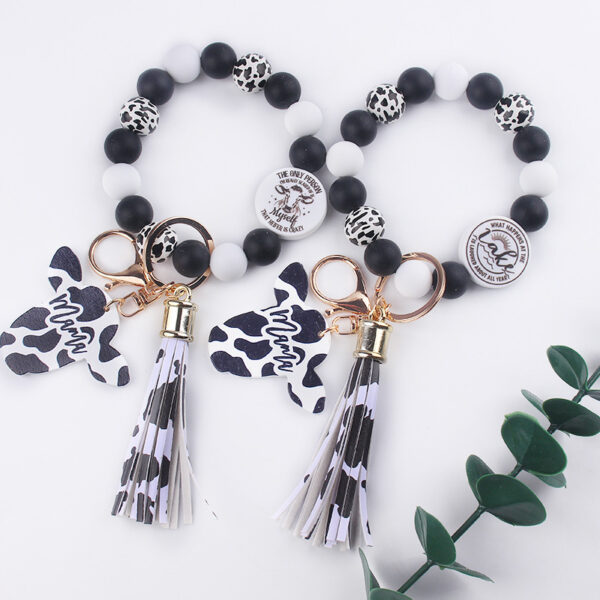 oly-f86be54d339a25fedda1f9cbf4712a4d Wholesale Silicone Cartoon Cow Head Keychain with Bead Bracelet and Tassel Korean Style Decorative Accessory