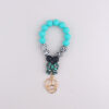 oly-f8b47de98544441028f5130bb3f69fe3 Wholesale Korean Style Silicone Cow Bow Keychain Charm Trendy Bag Car Key Accessory Gift