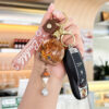 oly-f9fccc0340fd2b8a5a66e74d630bfca3 Wholesale Oil filled Wind Chime Acrylic Keychain Bag Charm Gift for Boutique Resale