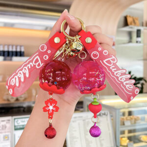 oly-facec670ec4422d5f8dd0190be4b9231 Wholesale Oil filled Wind Chime Acrylic Keychain Bag Charm Gift for Boutique Resale