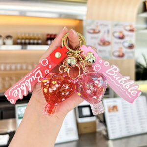 oly-fb5a10c7b90369a30d1778971449fe02 Wholesale Decorative Pink Hot Air Balloon Acrylic Keychain with Oil Filled Quicksand Bag Charm Gift