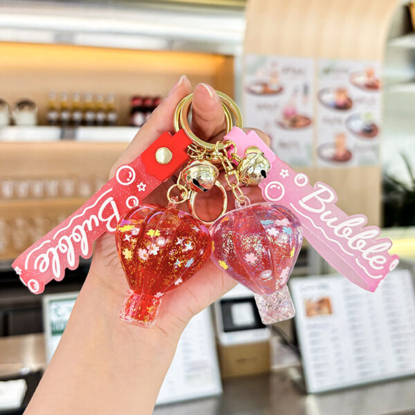 oly-fb5a10c7b90369a30d1778971449fe02 Wholesale Decorative Pink Hot Air Balloon Acrylic Keychain with Oil Filled Quicksand Bag Charm Gift