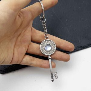 Diamond-encrusted key transparent blue [round buckle style]