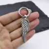oly-ff3ba7805de48e05eca78e7feae1d5ce Wholesale Angel Wings Alloy Keychain, Silver Fashion Accessory for Car Keys and Bags
