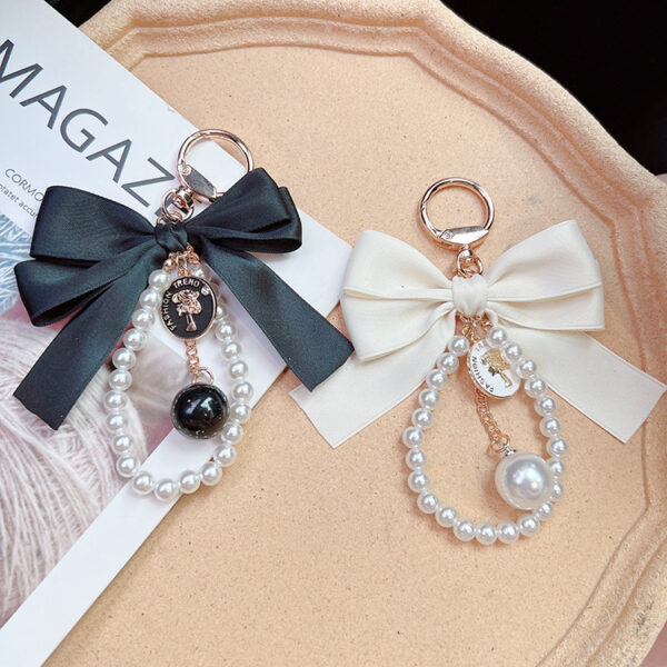 oly-099666a1b210a957fd83ddc72f86d35e Wholesale Large Bow Pearl Chain Keychain For Women Car Key Accessory Handbag Charm Boutique Resale