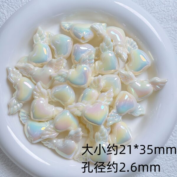 oly-115d8e1e46a9c16fa3077a8bcda4d12f Wholesale UV Plated Acrylic Glow in the Dark Heart Wing Beads for DIY Phone Charm Keychain Craft Supplies Resale
