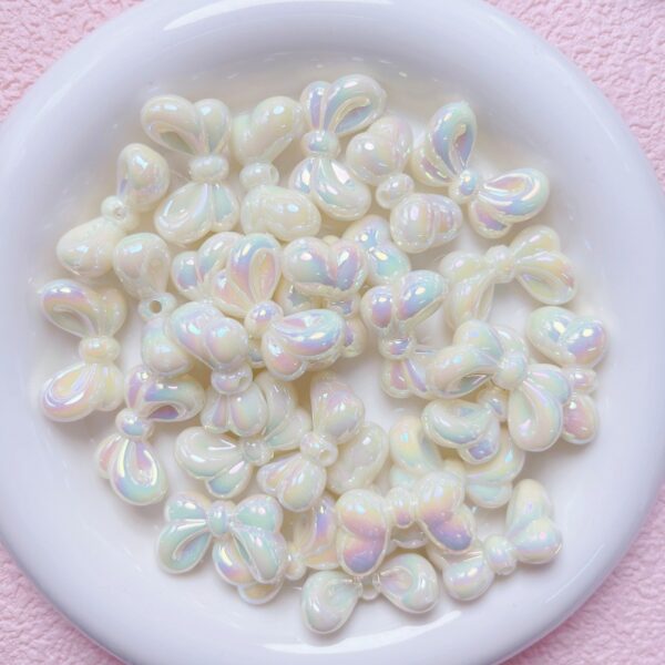 oly-13dc5d8e513990af153b965679f44268 Wholesale Bowtie Acrylic Loose Beads UV Plated Light Pink DIY Supplies for Phone Charms Keychains Bag Crafts